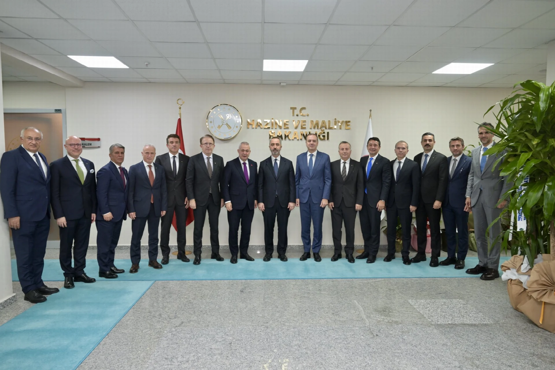 The photograph shows the delegation from İMEAK Chamber of Shipping during their official visit to the Turkish Ministry of Treasury and Finance, directly matching the news article text.