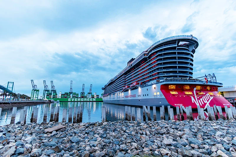 Clear photograph showing the Virgin Voyages cruise ship Brilliant Lady docked at port, directly relevant to the article discussing its West Coast cruise schedule.